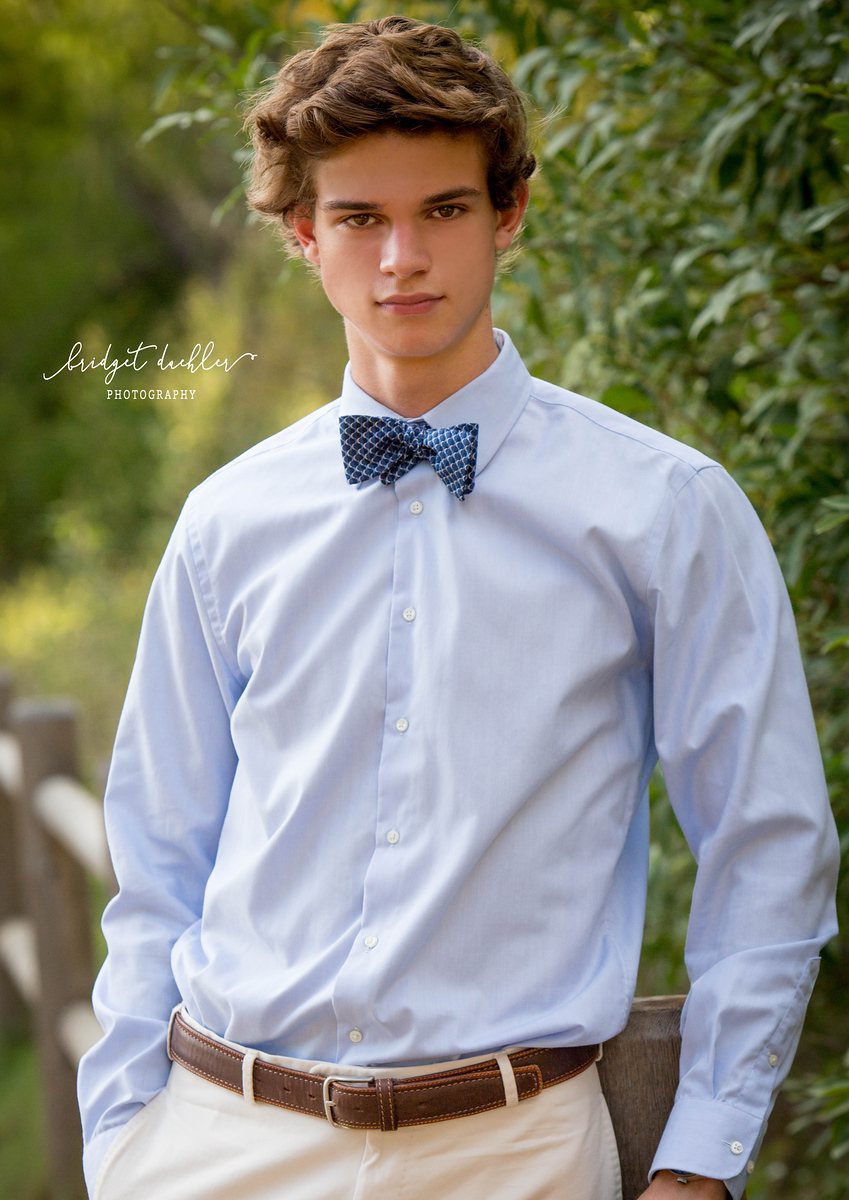 Natural-light senior portrait photographed at golden hour on location near Austin (vertical frame 16, variation 2)