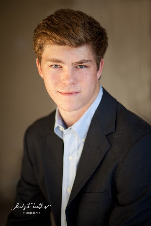 Full-length senior portrait on a quiet country road outside Austin, Texas (vertical frame 44, variation 4)