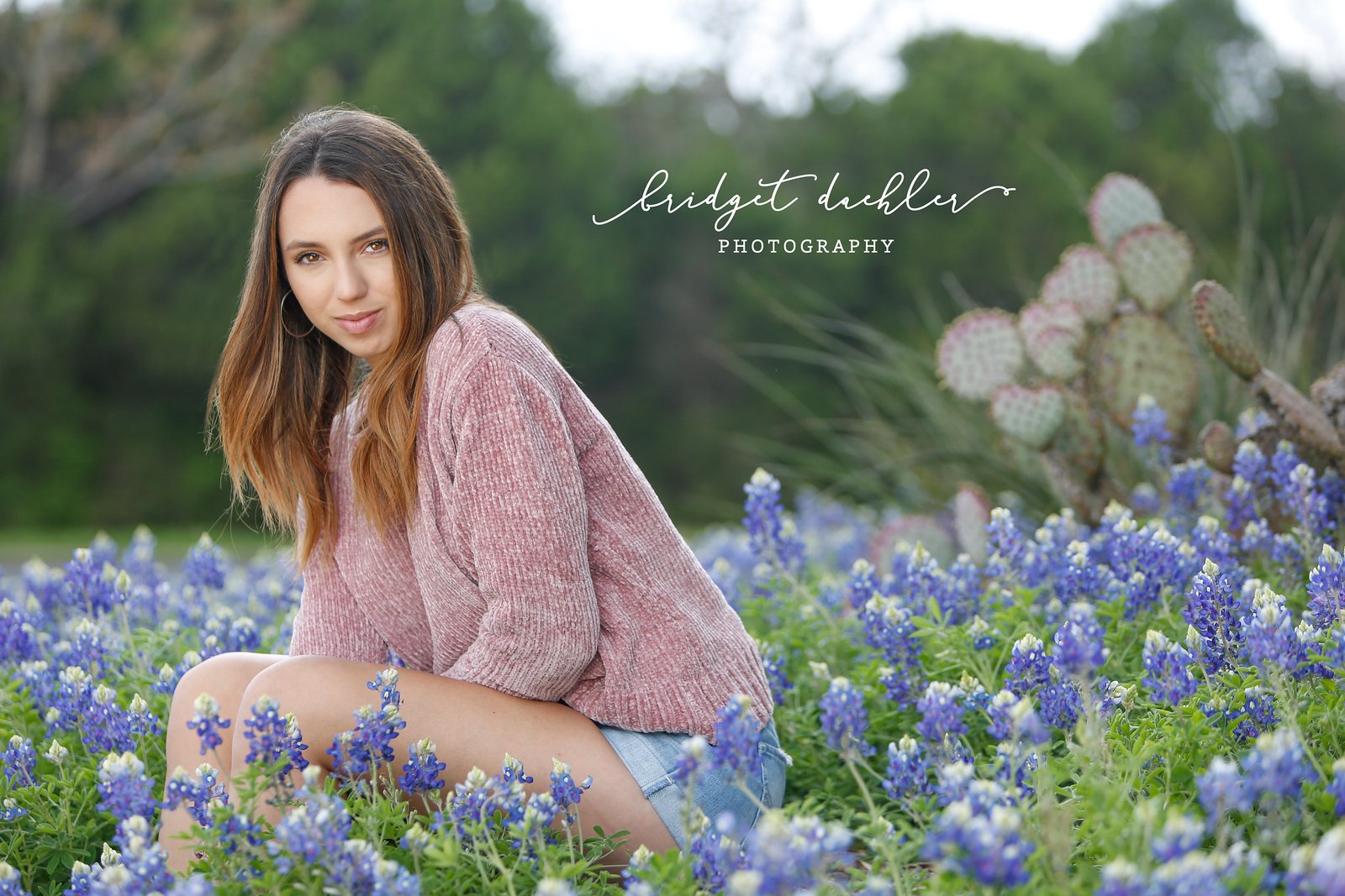 Senior portrait with soft backlight along a greenbelt trail in Austin, Texas (horizontal frame 29, variation 3)