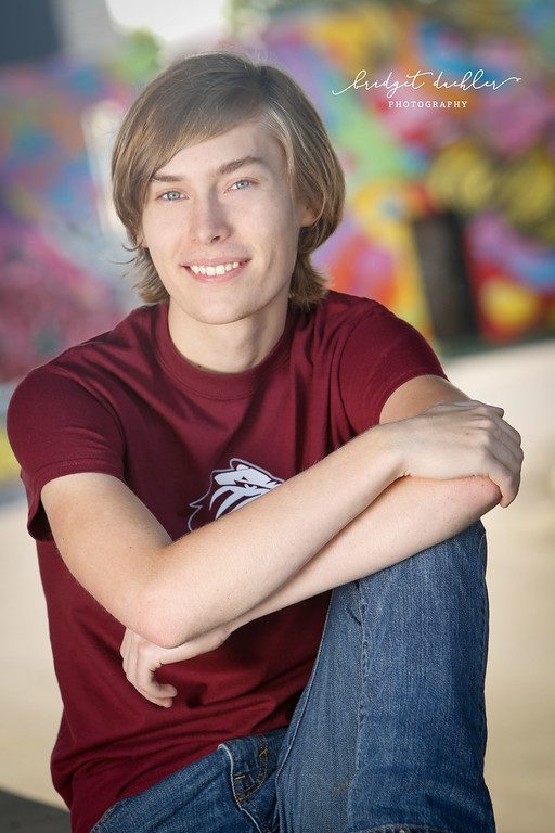 Candid laughing senior portrait photographed in open shade in Austin, Texas (vertical frame 45, variation 4)