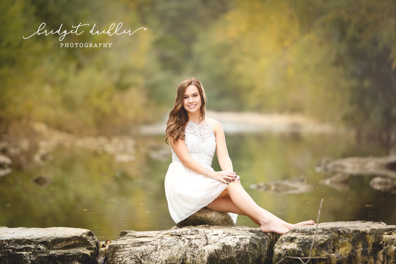 Senior portrait among wild grasses lit by low evening sun near Austin (horizontal frame 10)