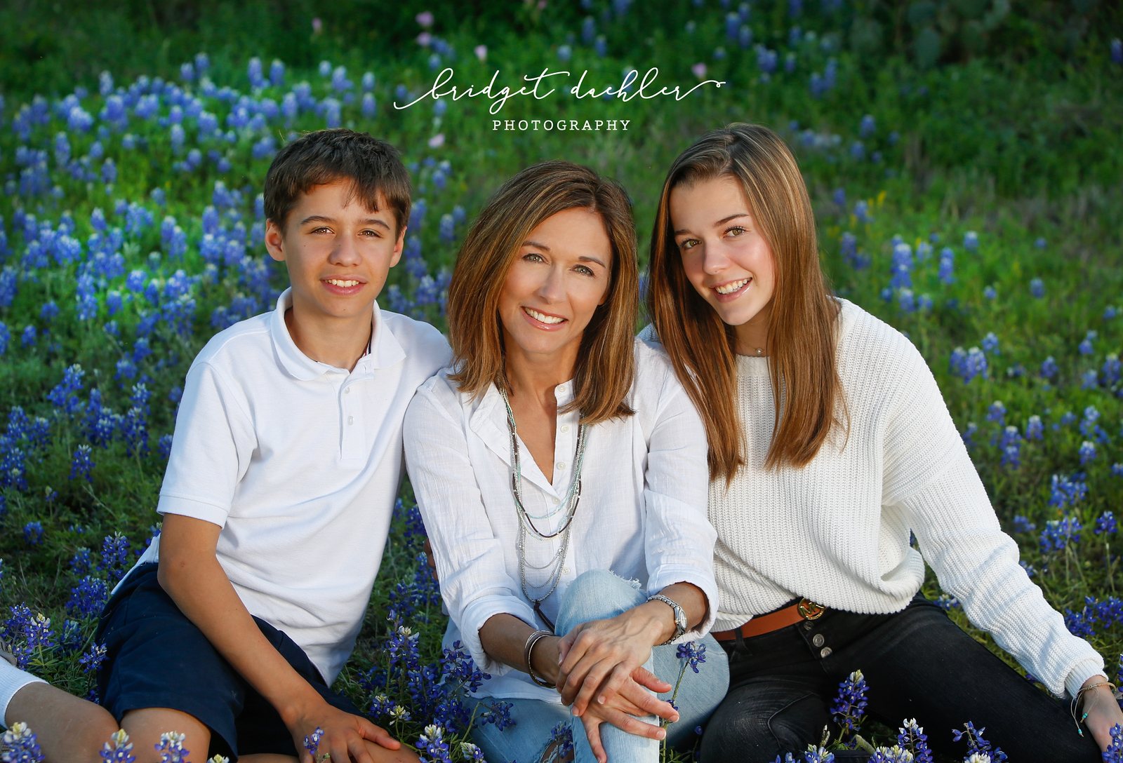 Family laughing together on a natural-light session in the Texas Hill Country (horizontal frame 22, variation 3)