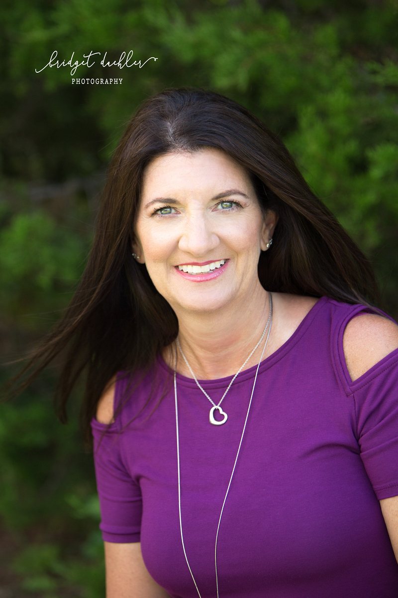 Studio-style headshot with simple backdrop for an Austin professional (vertical frame 29, variation 4)