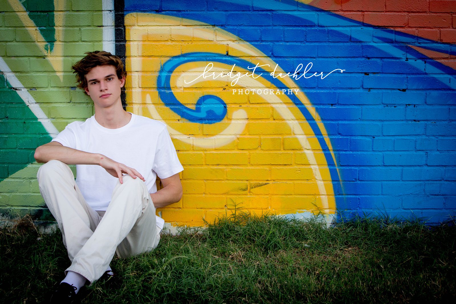 Full-length senior portrait on a quiet country road outside Austin, Texas (horizontal frame 32, variation 3)