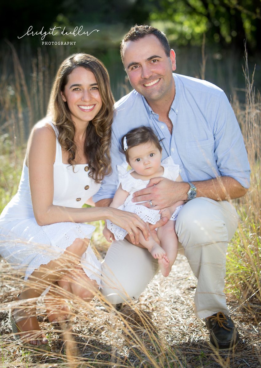 Unposed family portrait during a golden-hour session in Austin, Texas (vertical frame 1)