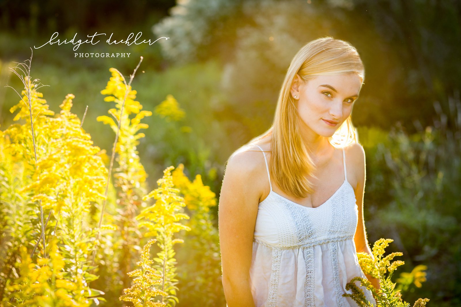 Senior portrait of a graduate posed against warm evening light in Austin, Texas (horizontal frame 26, variation 3)