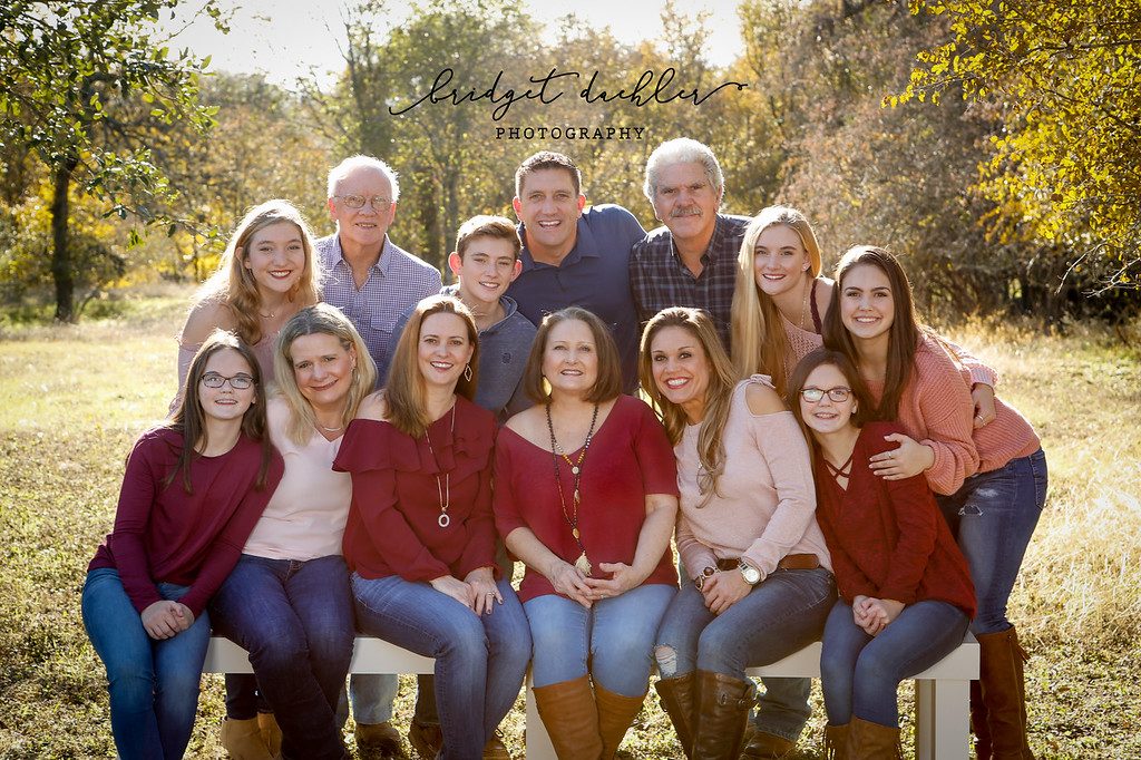 Family session portrait under live oaks at golden hour near Austin, Texas (horizontal frame 45, variation 5)