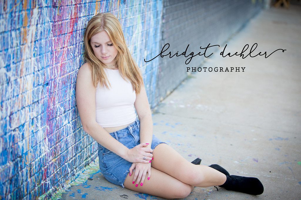 Senior portrait with soft backlight along a greenbelt trail in Austin, Texas (horizontal frame 41, variation 4)