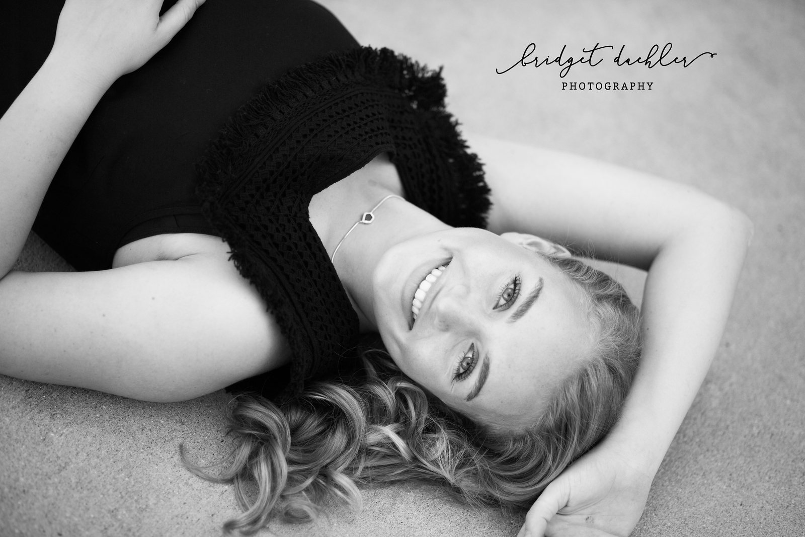 Senior portrait with soft backlight along a greenbelt trail in Austin, Texas (horizontal frame 17, variation 2)