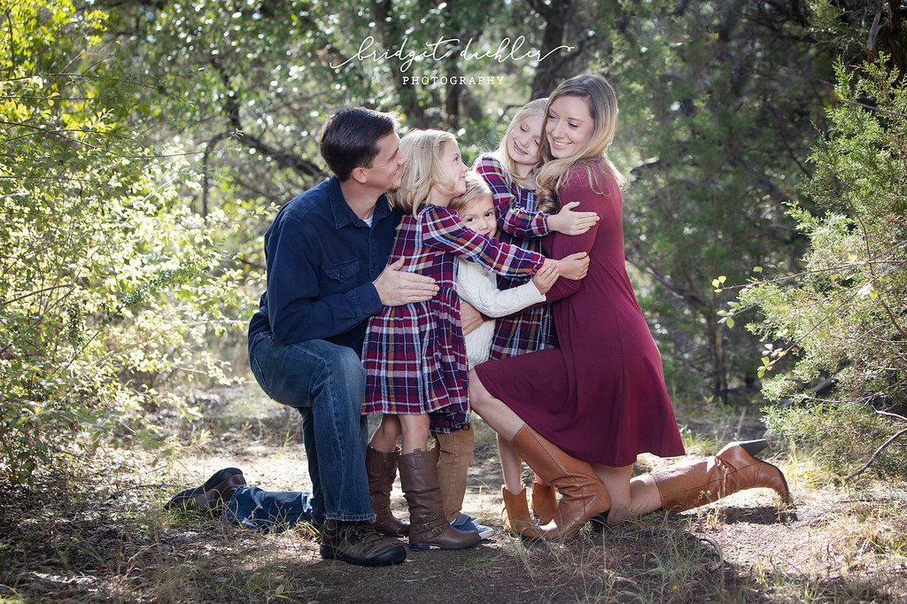Family laughing together on a natural-light session in the Texas Hill Country (horizontal frame 32, variation 4)