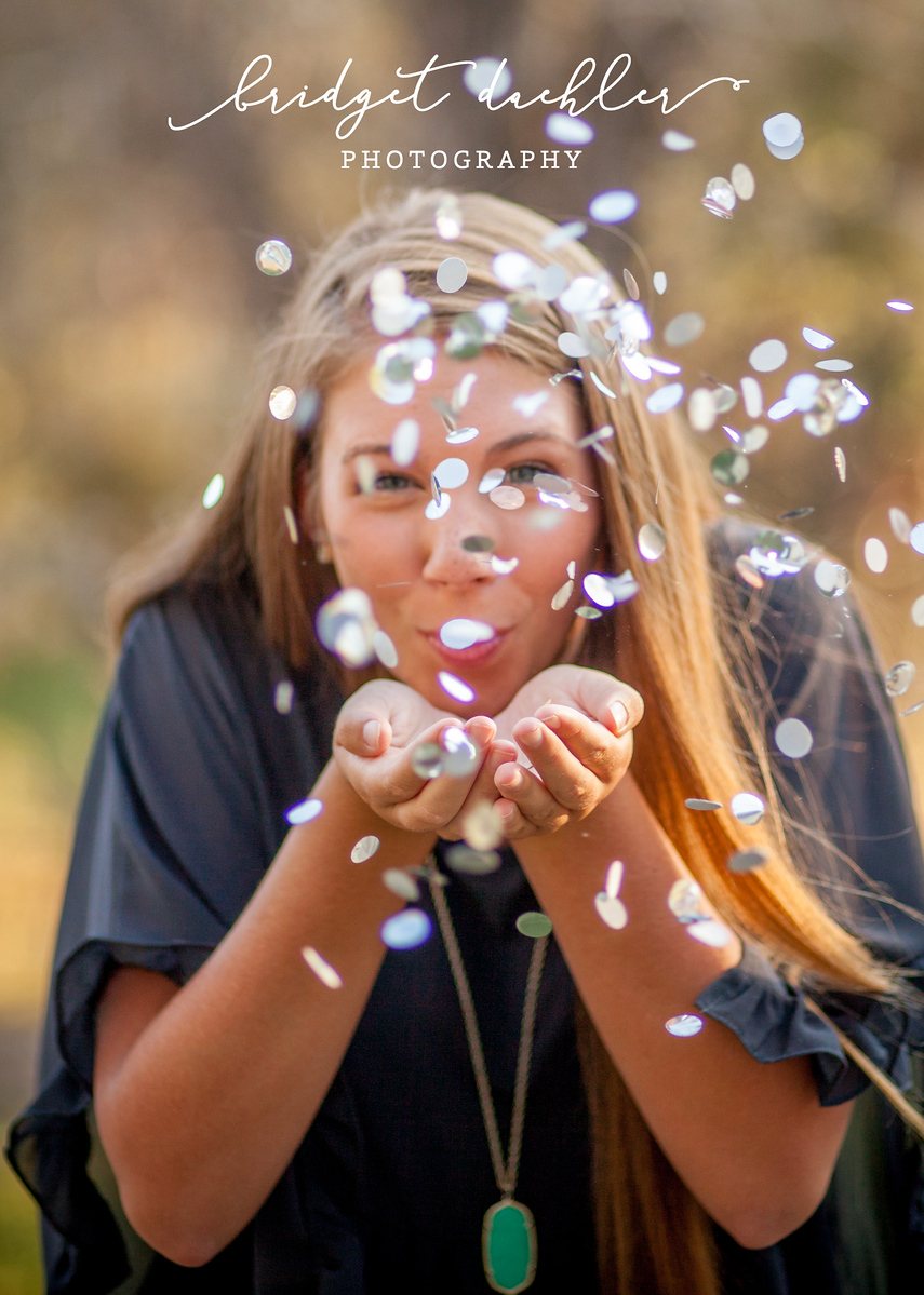 Senior portrait with soft backlight along a greenbelt trail in Austin, Texas (vertical frame 5)