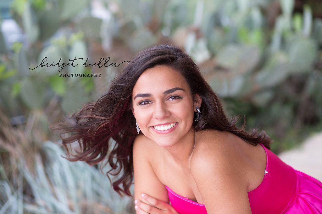 Natural-light senior portrait photographed at golden hour on location near Austin (horizontal frame 40, variation 4)