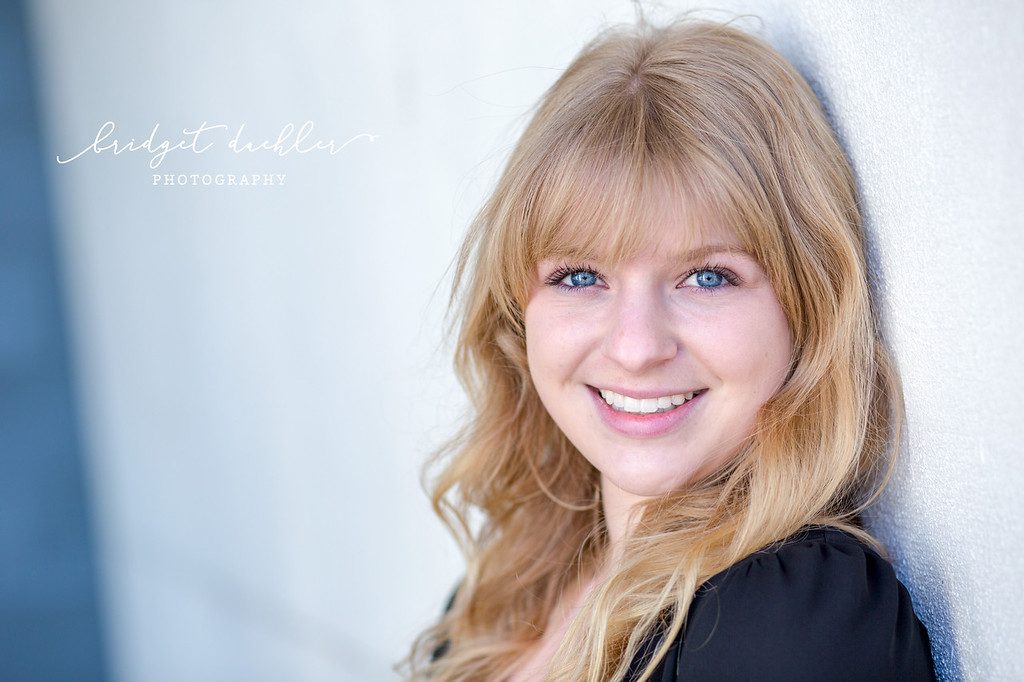 Senior portrait by the water at golden hour in the Austin Hill Country (horizontal frame 36, variation 3)