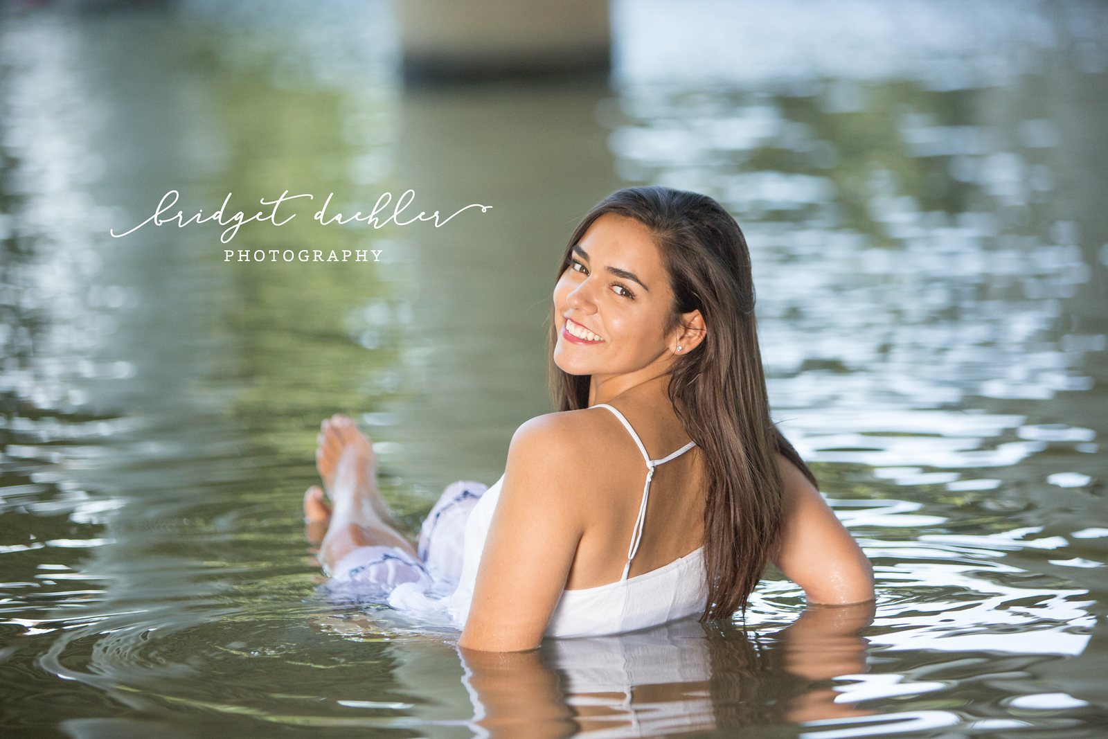 Golden-hour high school senior portrait taken in a Texas Hill Country field near Austin (horizontal frame 1)