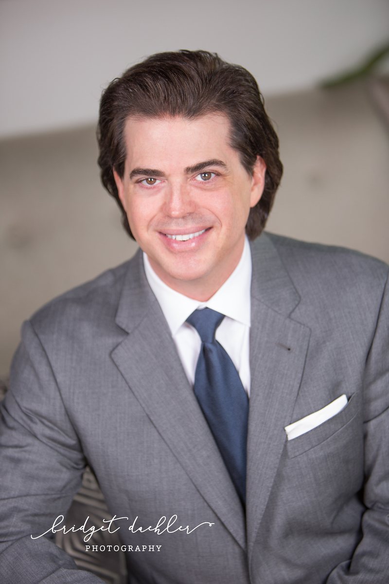 Actor headshot photographed outdoors in soft light in Austin, Texas (vertical frame 18, variation 3)