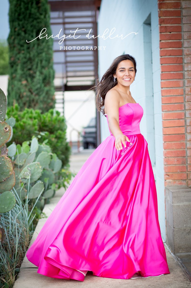Senior portrait session image with warm sunset tones in the Texas Hill Country (vertical frame 31, variation 3)